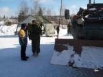 Cpl Gélinas explains to a member of the public what an Engineer LAV can do.