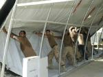 Troops dismantling warehouse