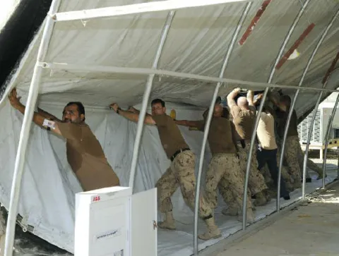 Troops dismantling warehouse