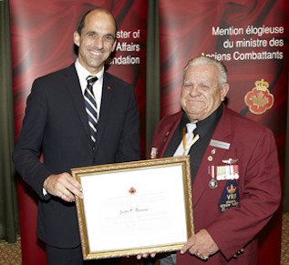  2Lt  Jeston V. “Buddy” Brennan (Ret’d) receiving a commendation from the Minister of Veterans Affairs