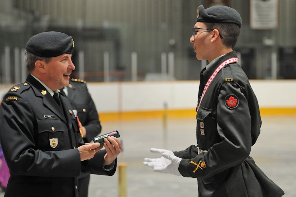 Cadet MWO Trevor Johnson receives Coronation Medal from Major Ken Prince (photo from Chilliwack Progress