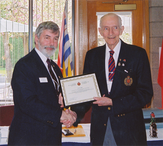 Al Loveridge receiving the CMEA Commendation from CMEA President John MacPherson