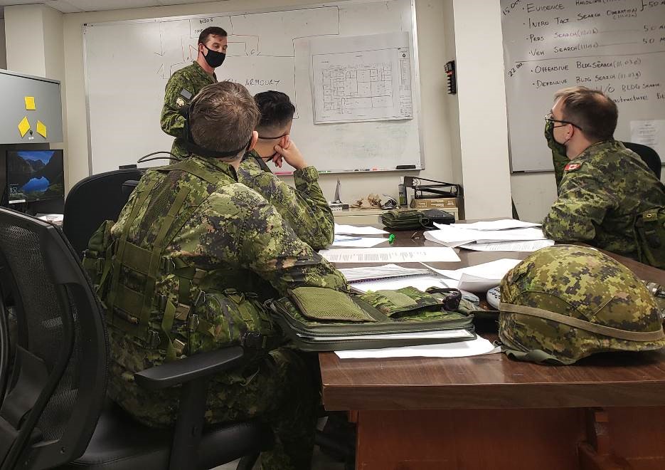 Lt Kurt Murseli, 61 Fd Tp Comd, gives orders to his section commanders