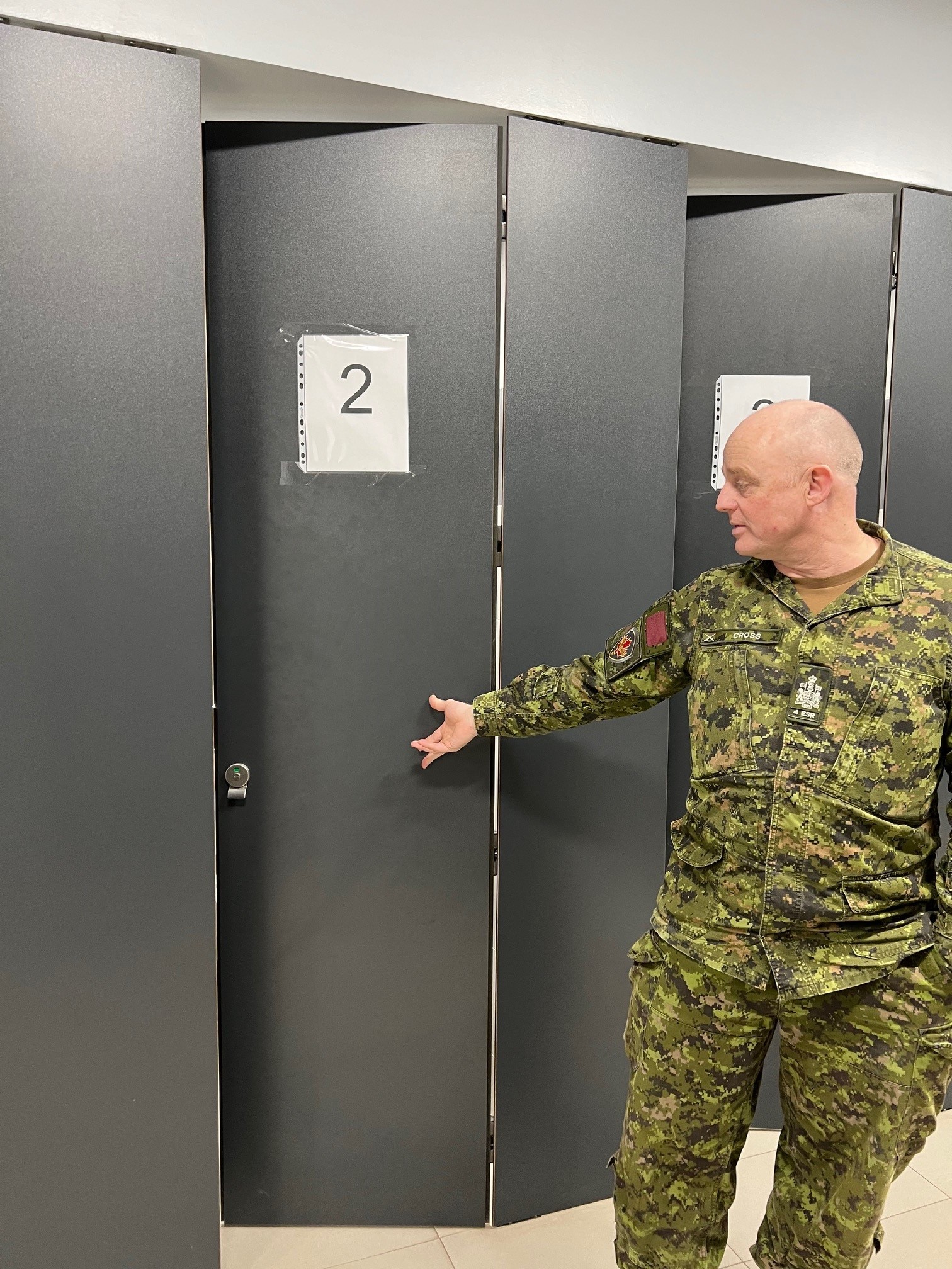 Gender-neutral bathrooms – CWO Frank Cross explained the gender-neutral bathrooms and showers designed for the RPM(B) students. Photo by Capt Kyle Ho, RPOU(W)