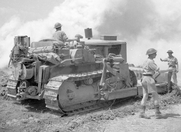 RCE bulldozer working in Italy. Reinforced steel plates and seat protected the driver and vehicle from mine blasts