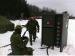 Cpl Kerr (electrical generating system tech) and Cpl Legendre (electrician), installing the power grid