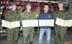 (Left to Right) Cpl Wayne Fraser, MCpl Andy Matthews, Sgt (Ret'd) Neil Cristo, and Cpl John Mac DonaId hold their Commander's Commendations following the presentation by Colonel Stephen Lacroix, Comd 3 CDSG, and CWO James Doppler, 