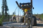 U.S. 652nd Engineer Company soldiers PFC Brian Johnston (front), from Johnsburg, IL, and Pvt Joshua Lehigh, from Marquette, MI, guide a bridge ramp into place during Op Northern Frontier. PHOTO: Cadet William P. Cynecki // Le PFC Brian Johnston (à l’avant) de Johnsburg, IL, et le Pvt Joshua Lehigh, de Marquette, MI, du U.S. 652nd Engineer Company, positionnent une rampe de pont  pendant l’opération Northern Frontier en août 2014. PHOTO : Cadet William P. Cynecki