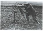 A Canadian surveyor sights a bearing with a traverse table alidade during the First World War. After the war, hundreds of trained surveyors applied their skills to mapping Canada. // Un arpenteur canadien établit un azimut à l’aide d’une table de point pendant la Première Guerre mondiale. Après la guerre, des centaines d’arpenteurs qualifiés ont mis leurs compétences à profit pour cartographier le Canada.