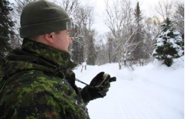 MCpl Dan Robinson marks a point along Birch Brook Ski course with his global positioning system devices. This will help him produce an accurate map of the Club's trail system.