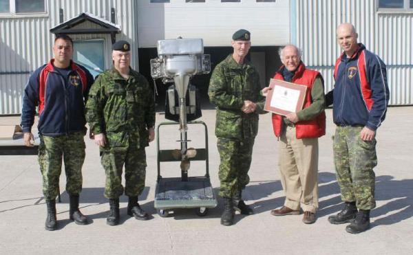 CWO Madore (RSM 2 CER), CWO Patterson (CME Branch CWO), 1943 EVINDRUDE 50 hp boat motor, BGen DesLauriers (CME Branch Colonel Commandant), Mr. Bill McVean and LCol Pilon (CO 2 CER). BGen DesLauriers is presenting Mr. Bill McVean with a CME Branch Commendation (certificate no 025) during the 2 CER CME Day on 26 April 2013 in Petawawa.