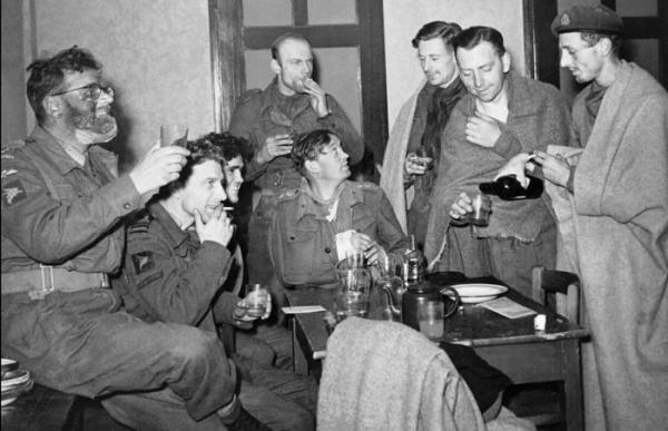 Arnhem survivors have their first drink after arriving at Nijmegen after the evacuation.