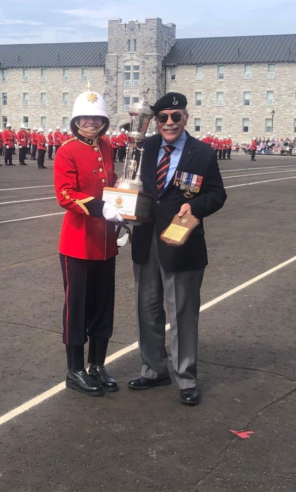 Col John Lesperance (Ret'd) presents the Maj Gen JA Stewart Trophy to 29710 OCDT Megan Roy.