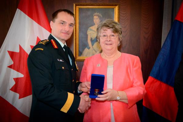 MGen JS Sirois, Chief Engineer, presents the “Sovereign’s Medal for Volunteers” to Mrs Shirley O'Connell 25 April 2019 (Photo by Canadian Forces Ottawa Base Imaging.)