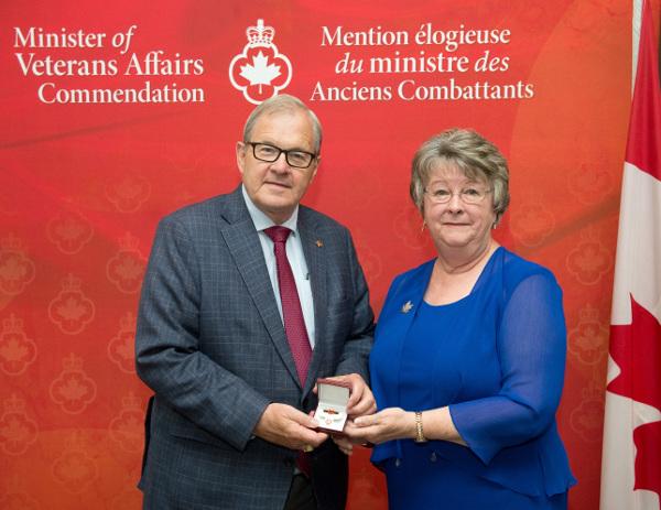Minister of Veterans Affairs presents his commenation medal to Shirley O'Connell