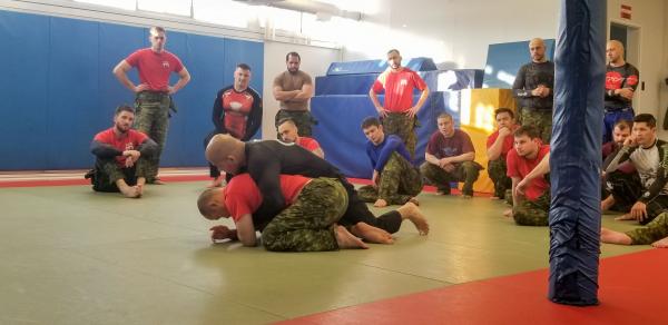 BJJ Seminar – Professor Carlos Alexandra Rodrigues demonstrating his techniques on Capt Kyle Ho to CFB Edmonton Grappling Team Photo by Cpl Ilya Karassev