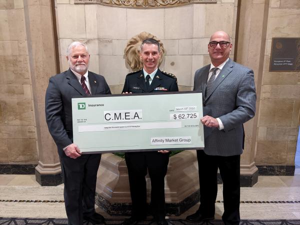 On hand to receive the cheque from Mr Luc Naud, TD Monnex, were CWO Louis Myre (Ret'd), Vice President CMEA and MGen Daniel Benjamin (Ret'd), CME Colonel Commandant 