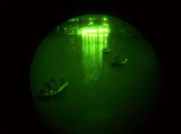 Assault boats operated by sappers of 52 Sqn cross the St Maurice River at night.