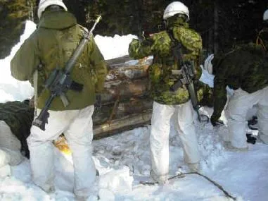 Sappers apply explosive charges to the first barricade. Credit: Lt Kevin Madore