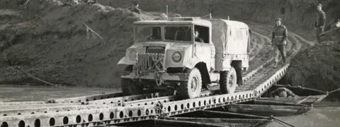A CANADIAN VEHICLE CROSSES ITALY’S MONTONE RIVER, LATE 1944.