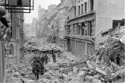 Canadian troops moving through Caen after D-Day