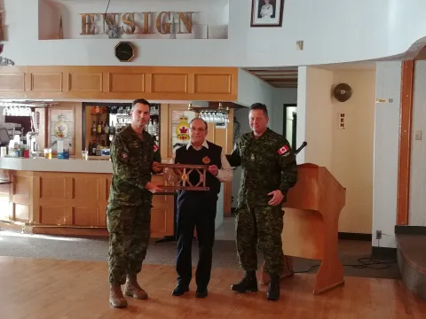 Dennis Dwyer receives CO's Coin and Bailey Bridge panel from 1 CER.