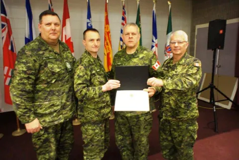 CWO R.G. Swift (CME Branch CWO), MGen J.S. Sirois (CAF Chief Military Engr), Sgt J.J.C. Maillet and the CME Branch Col Cmdt, BGen S.M. Irwin (Ret’d). Presentation date: 16 Feb 2017