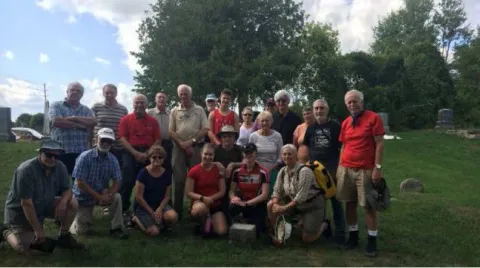 Visiting the cemetery: RMC canoe trip crew alongside Royal Sapper & Miners Committee members. 